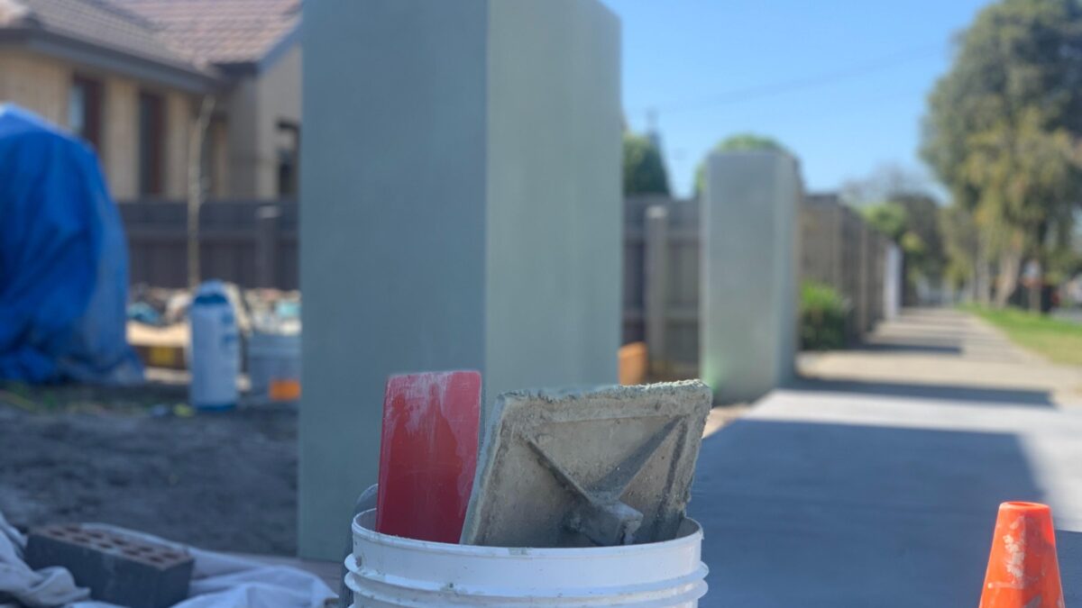 Rendered fence progress on a Sunshine Coast block wall