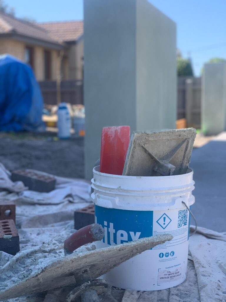 Rendering tools and materials on a Sunshine Coast blockwork site