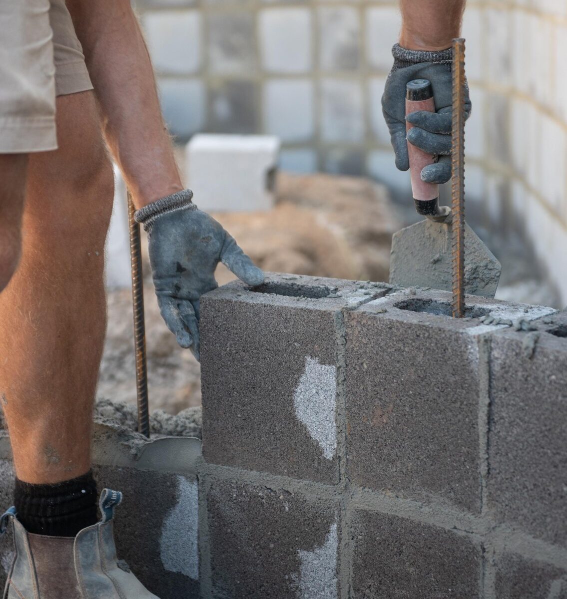 Curved concrete block wall being laid on the Sunshine Coast