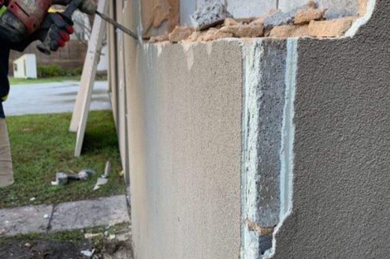 A damaged brick fence in Buddina being removed to be replaced with a decorative brick fence